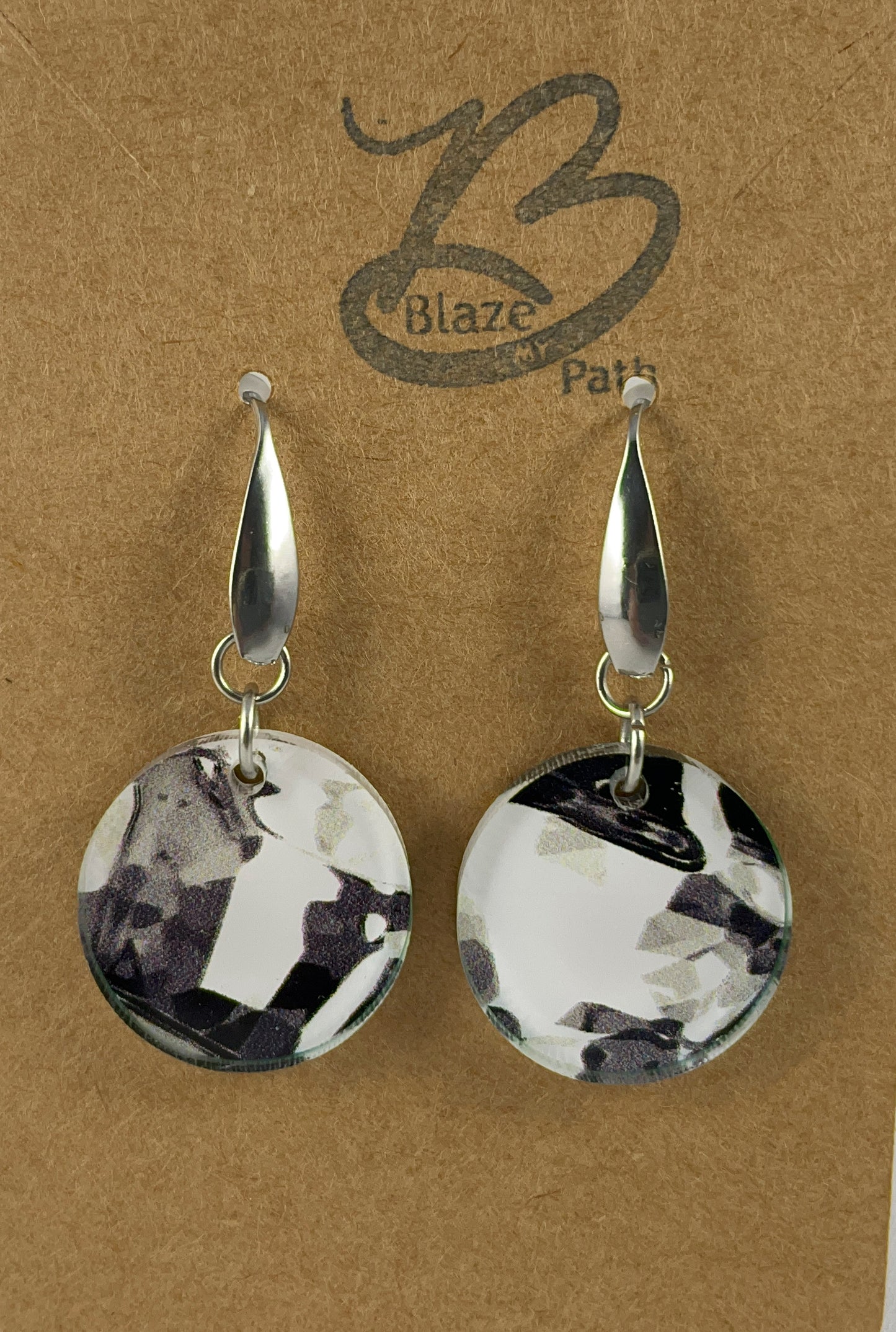 Small round abstract black and white acrylic dangle earrings on stainless steel ear wires with teardrop accent