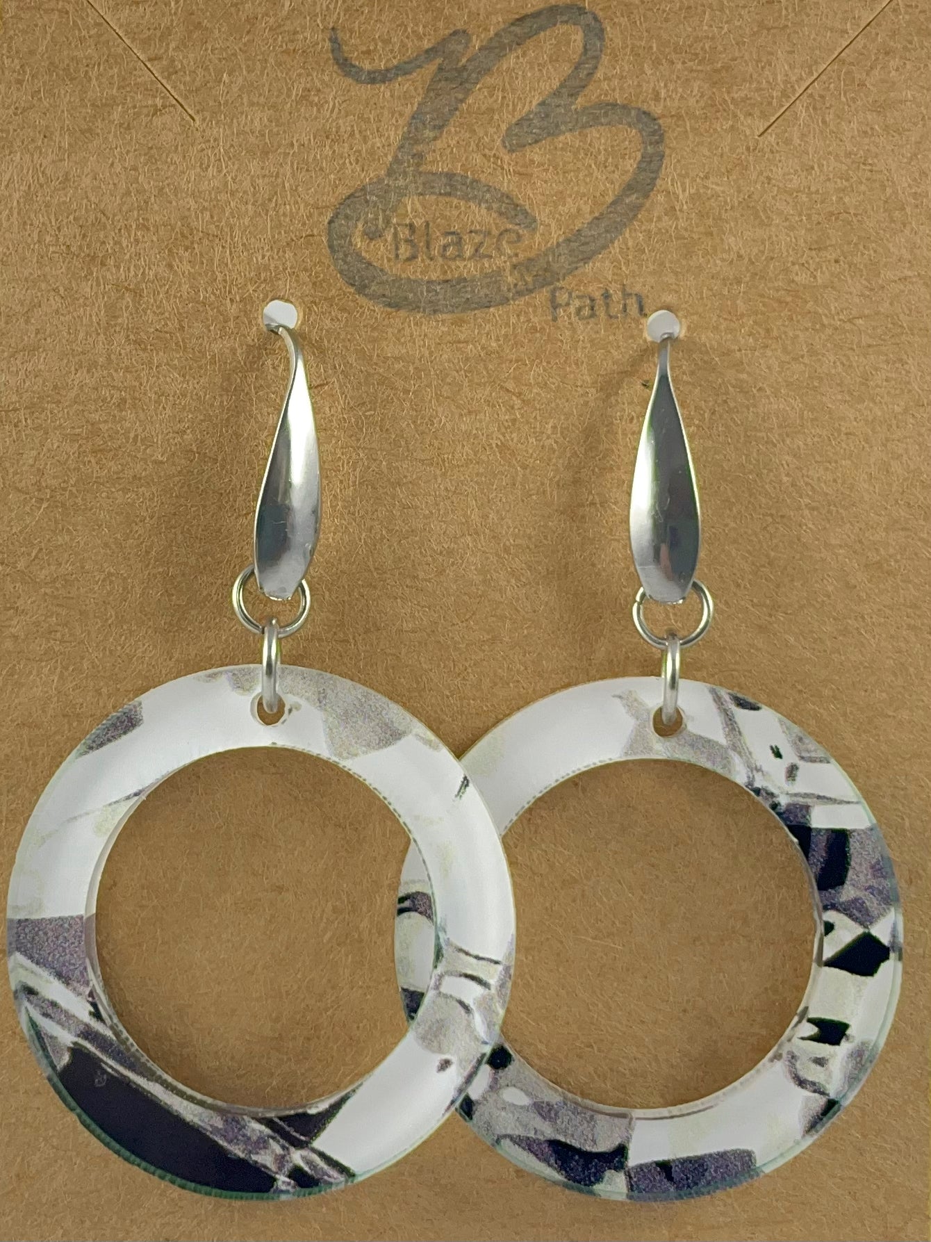 Open round abstract black and white acrylic dangle earrings on stainless steel ear wires with teardrop accent