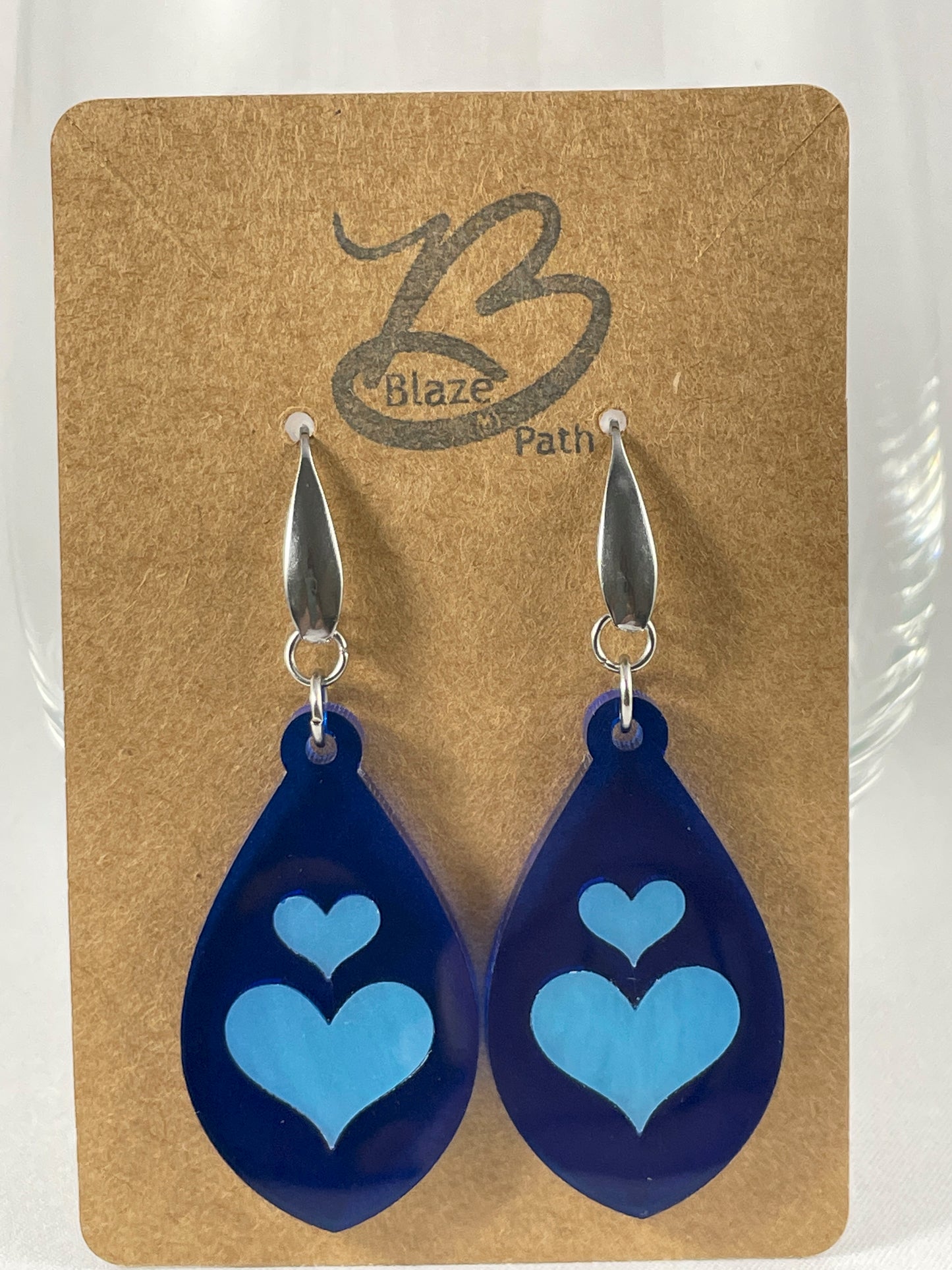 Lapis blue acrylic teardrop earrings with light blue inlay hearts on stainless steel ear wires with teardrop accent