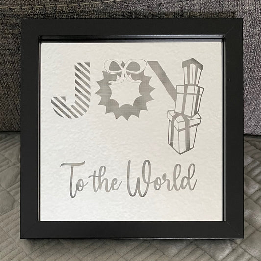 Joy To The World engraved on mirror in black square